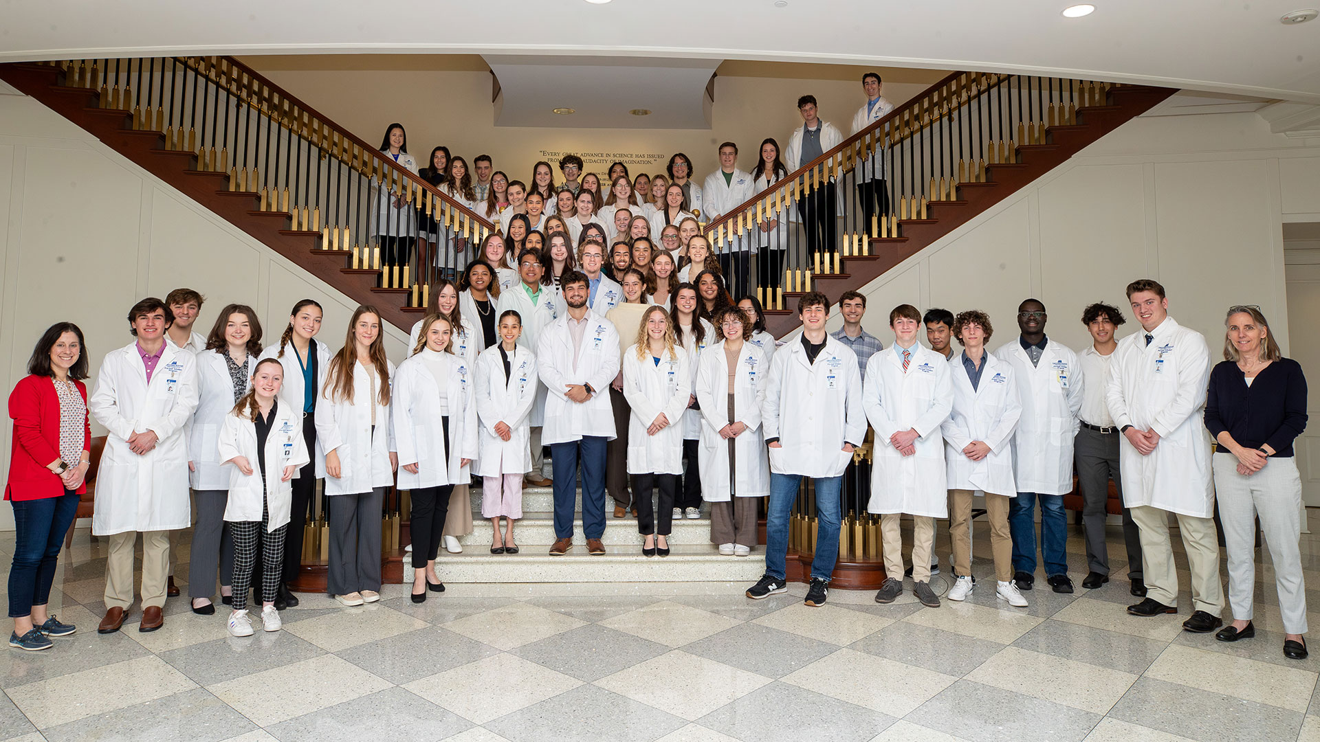 Pre-Med scholars in their white coats 