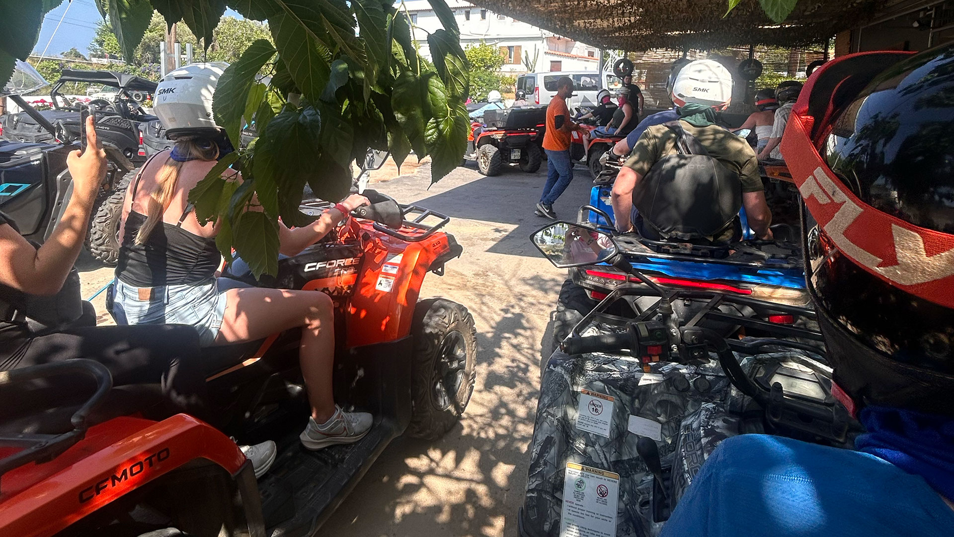 Students sit on ATVs