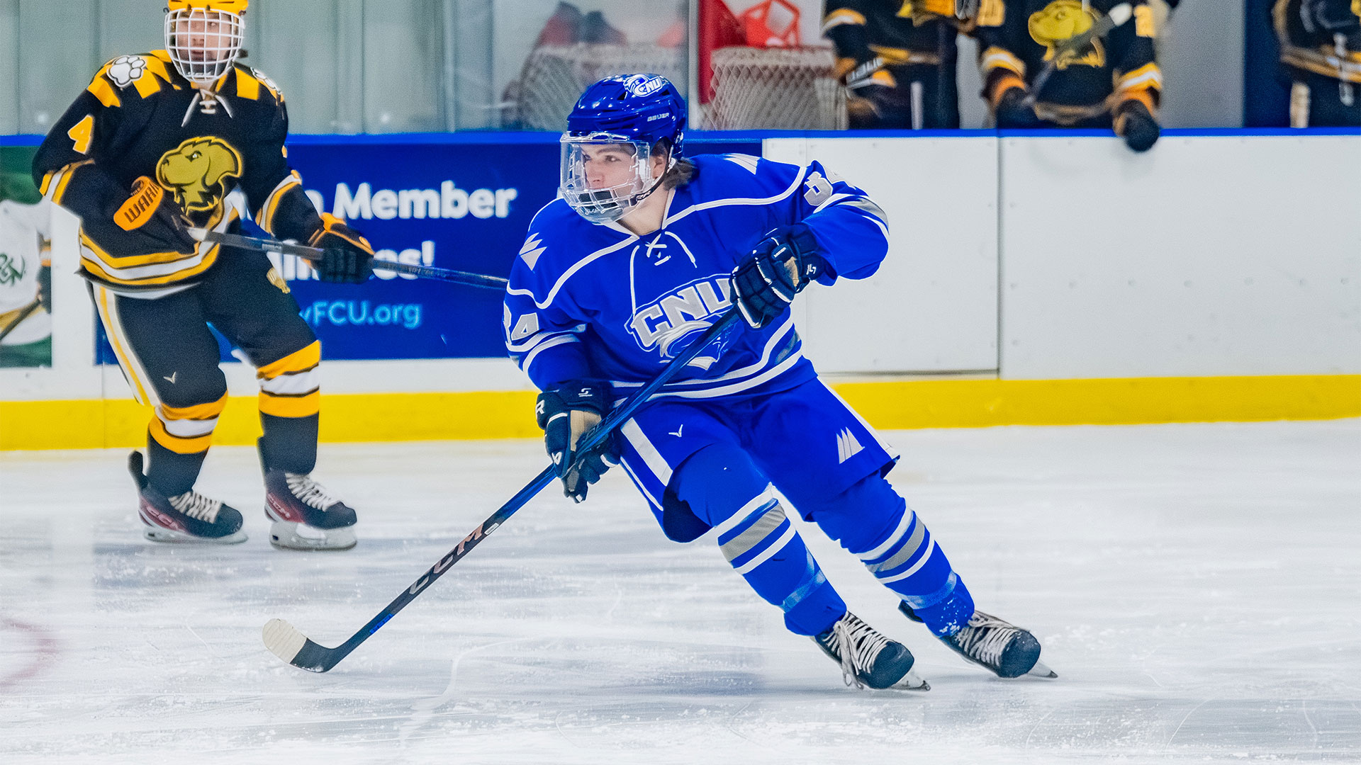 CNU men's ice hockey player skates on the ice during a game