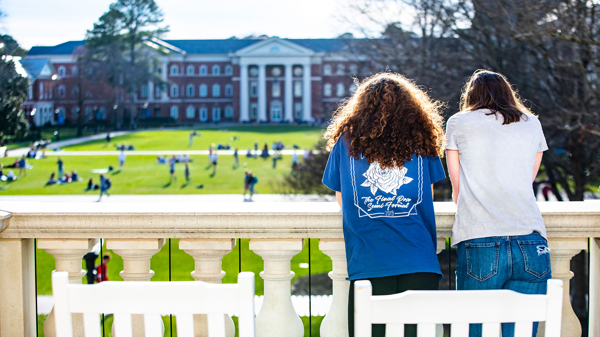 Two girls look out at the Great Lawn from CNH