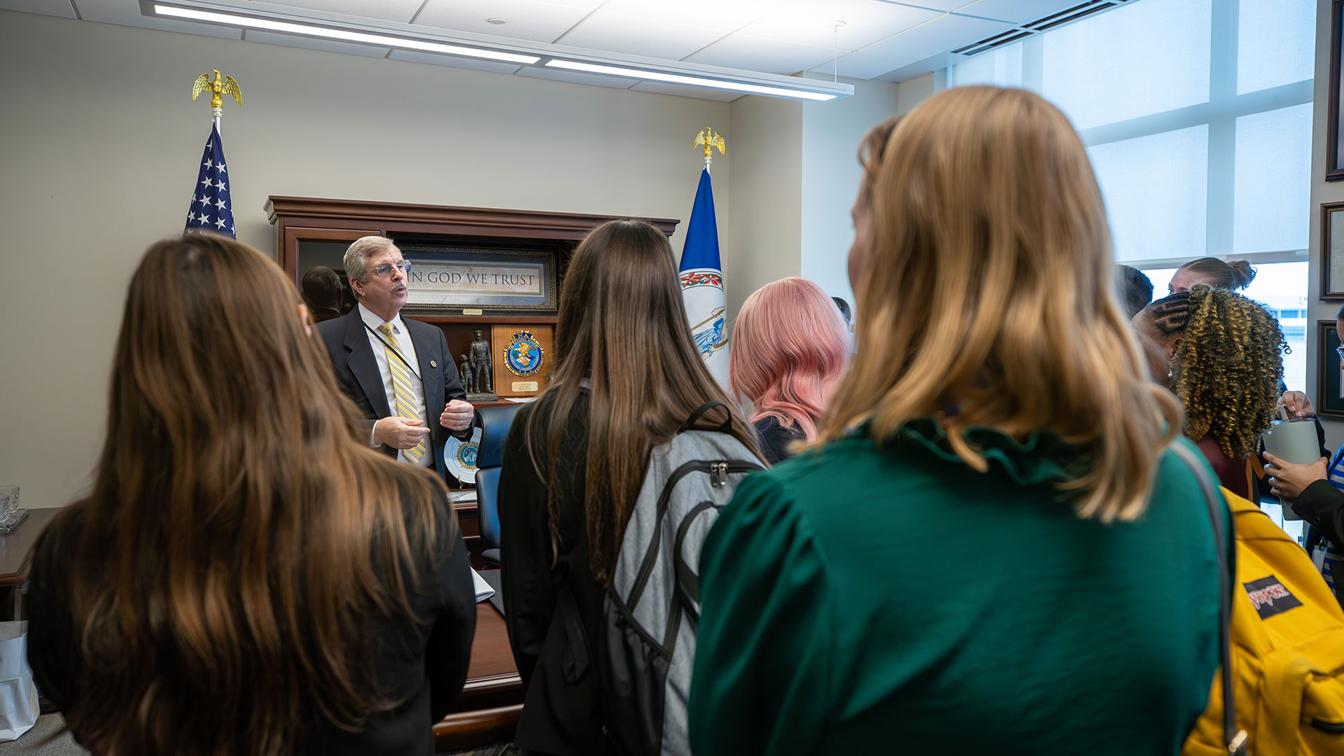 Captains speak with a VA delegate in the capitol