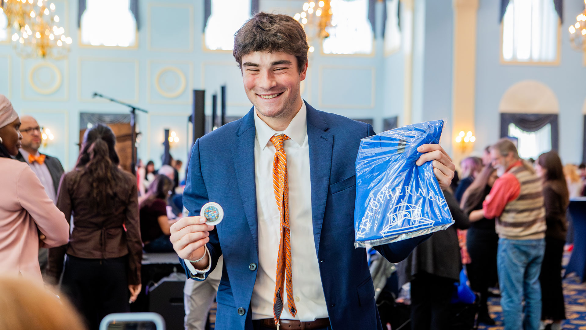 Male student smiles for the camera at Sophomore Signing Day.