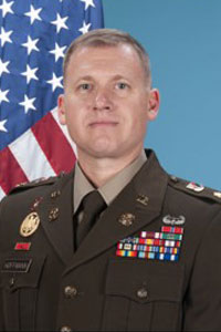 MAJ Jerad Hoffmann in military uniform and American flag in the background