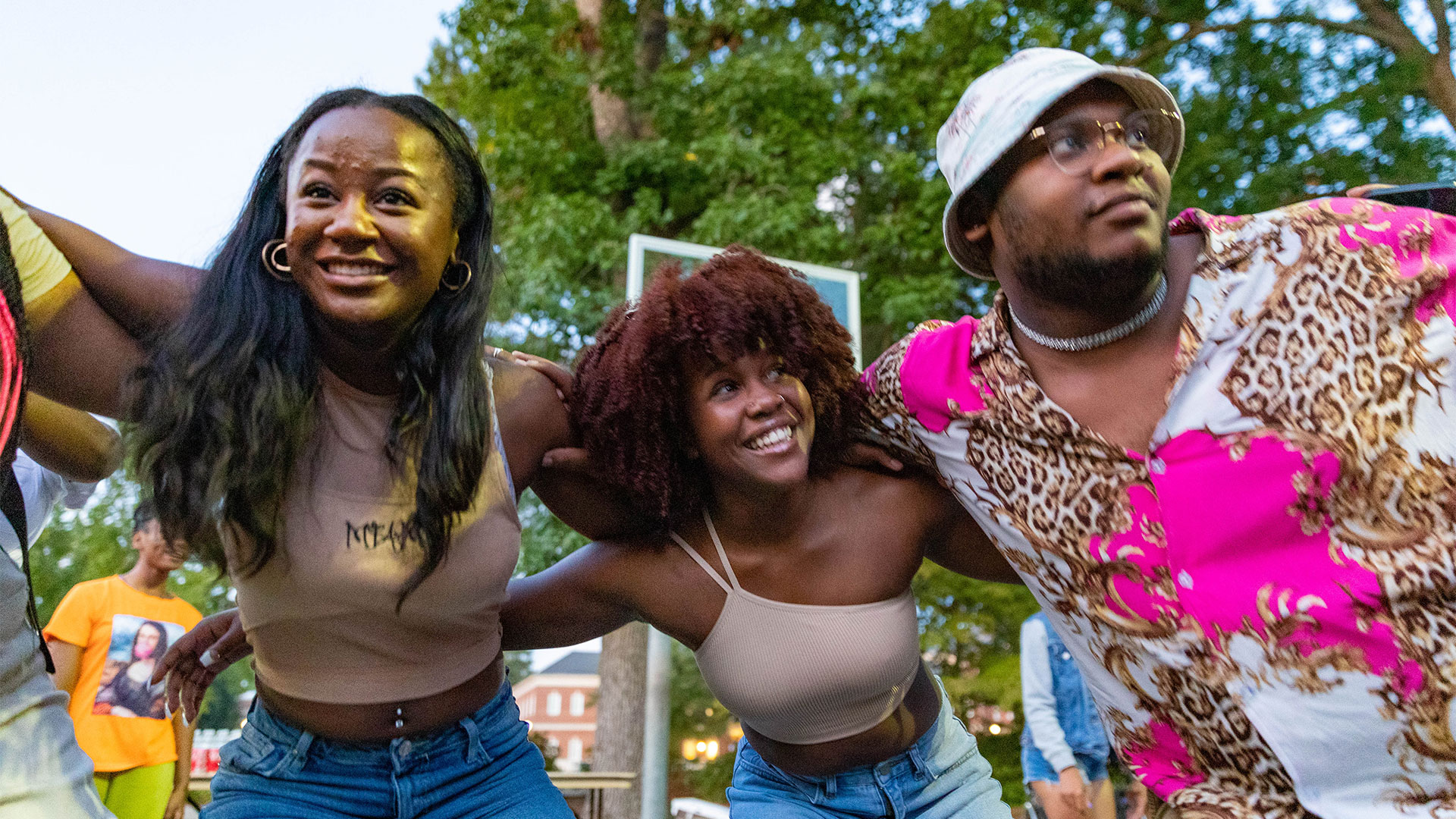 A group of students hug at the Black Student Union Block Party